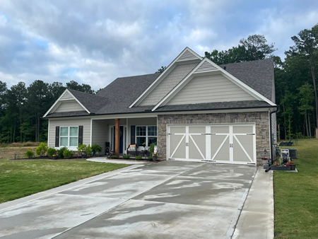 After photo of exterior house cleaning with bright clean siding